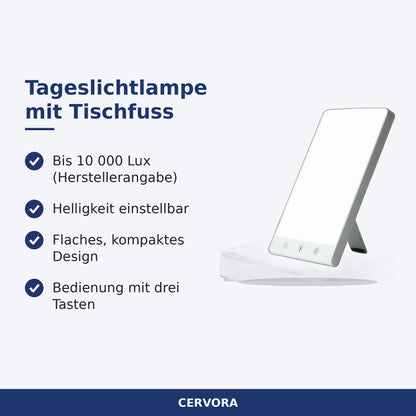 Flache Tageslichtlampe mit rechteckiger Leuchtfläche und Tischfuss auf einem Schreibtisch