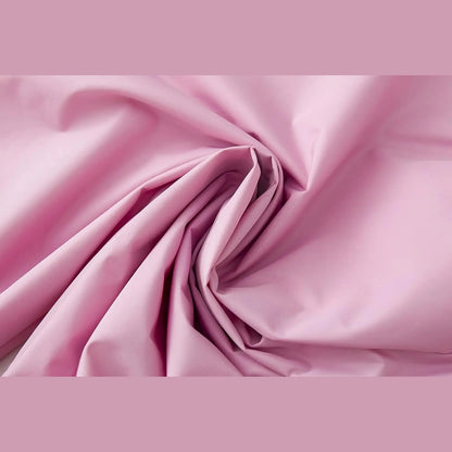 Kinder-Regenanzug mit Kapuzenjacke und Hose in Blau mit Dinosaurier-Motiv und in Rosa mit Einhorn-Motiv